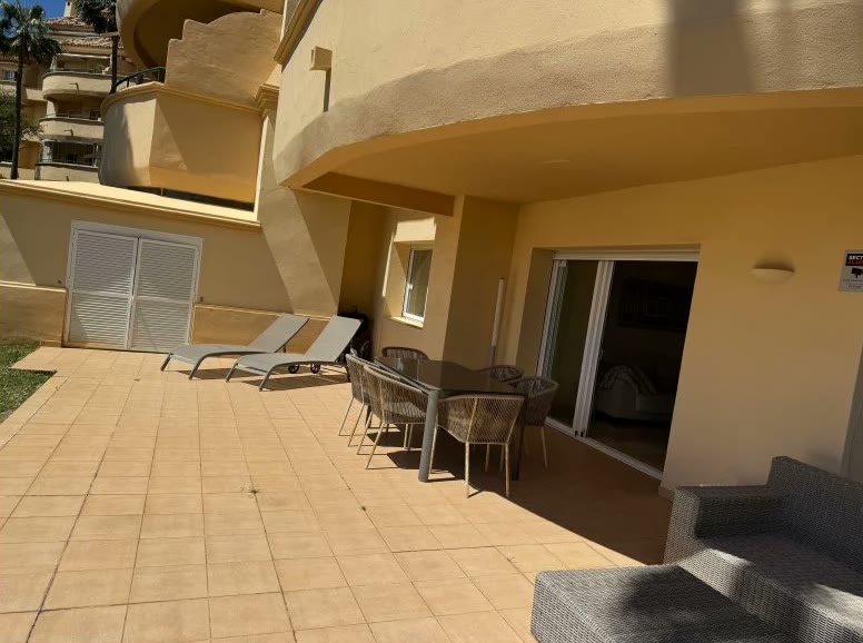 The same terrace in a phone snapshot, tilted and overexposed