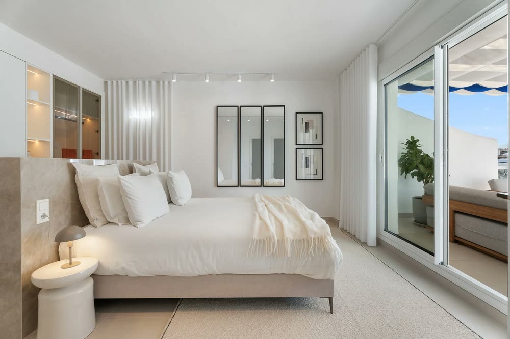 Light-filled bedroom with sliding doors to a terrace