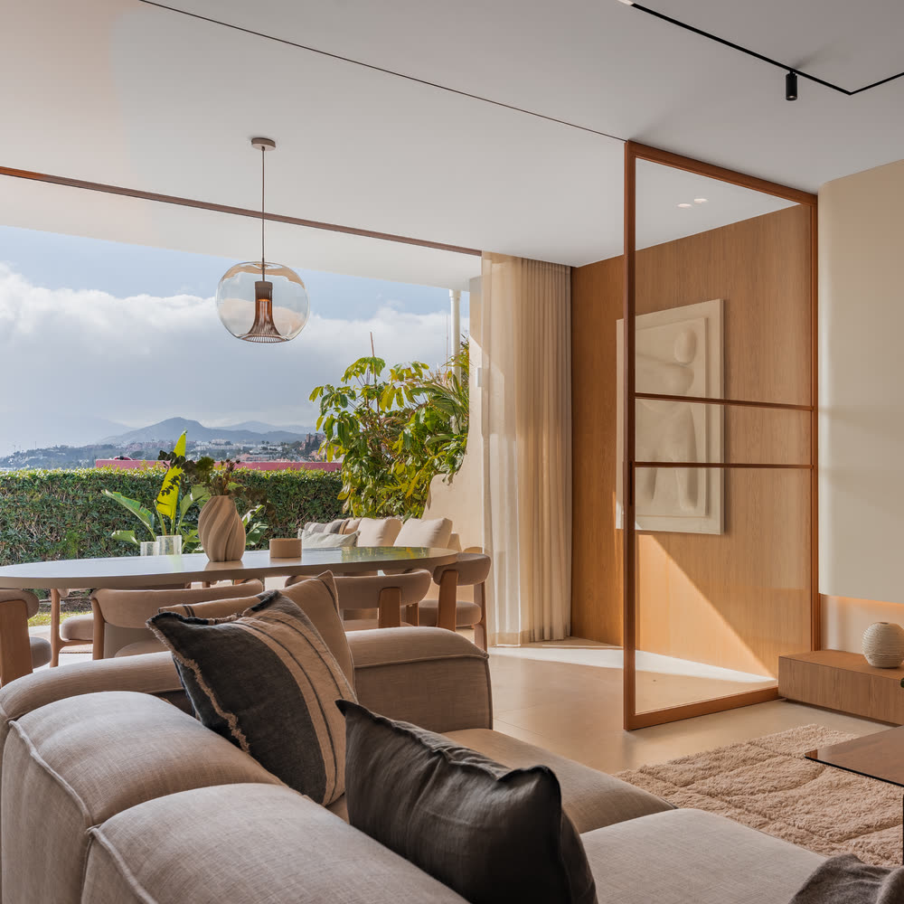 Sitting area by a tall window looking onto the garden