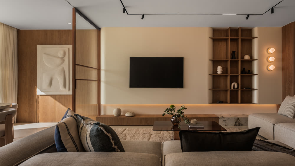 Living room with an oak media wall and sculptural art