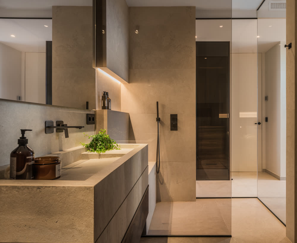 Bathroom with stone vanity and walk-in shower