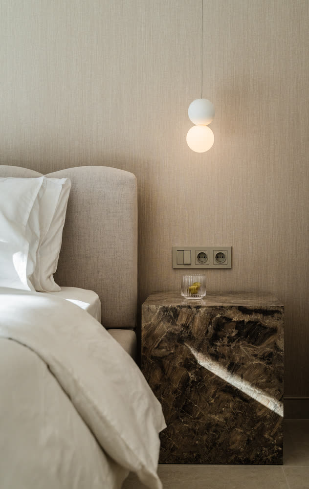 Guest bedroom with a marble bedside table